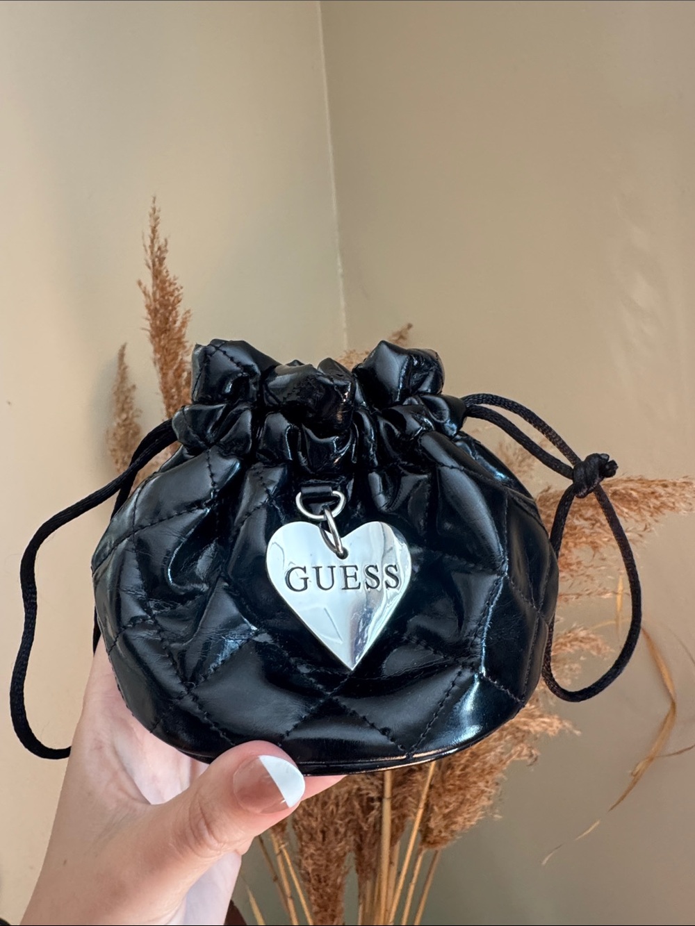 GUESS Black Quilted Patent Mini Drawstring Bag with Silver Heart Charm